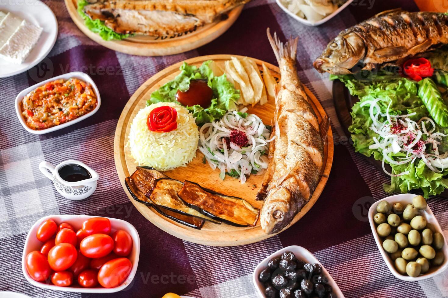 Table Set With Plates of Delicious Food photo