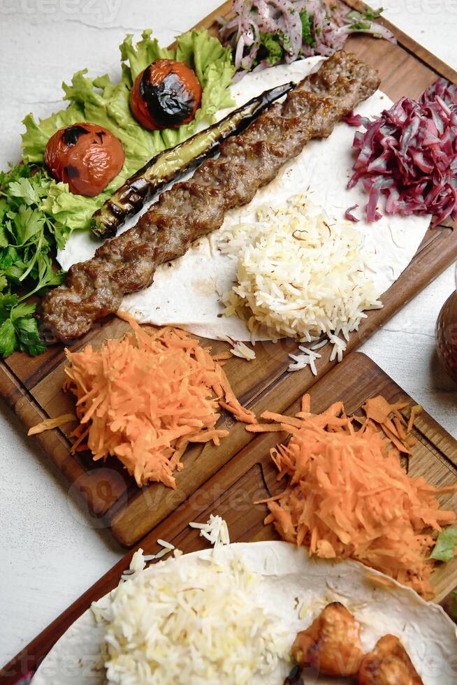 Assorted Foods Arranged on a Wooden Cutting Board photo