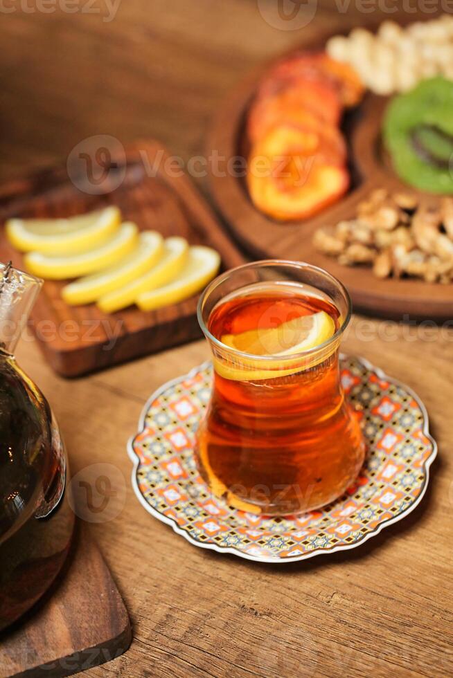 Pitcher of Tea on Wooden Table photo