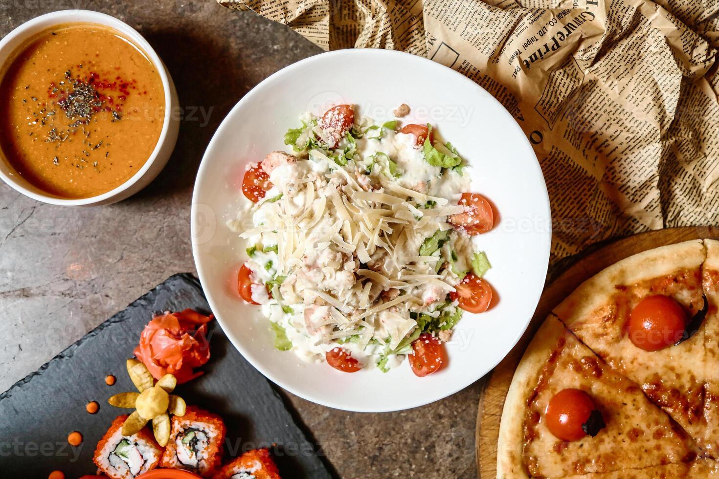 Table With Food Plates and Bowl of Soup photo