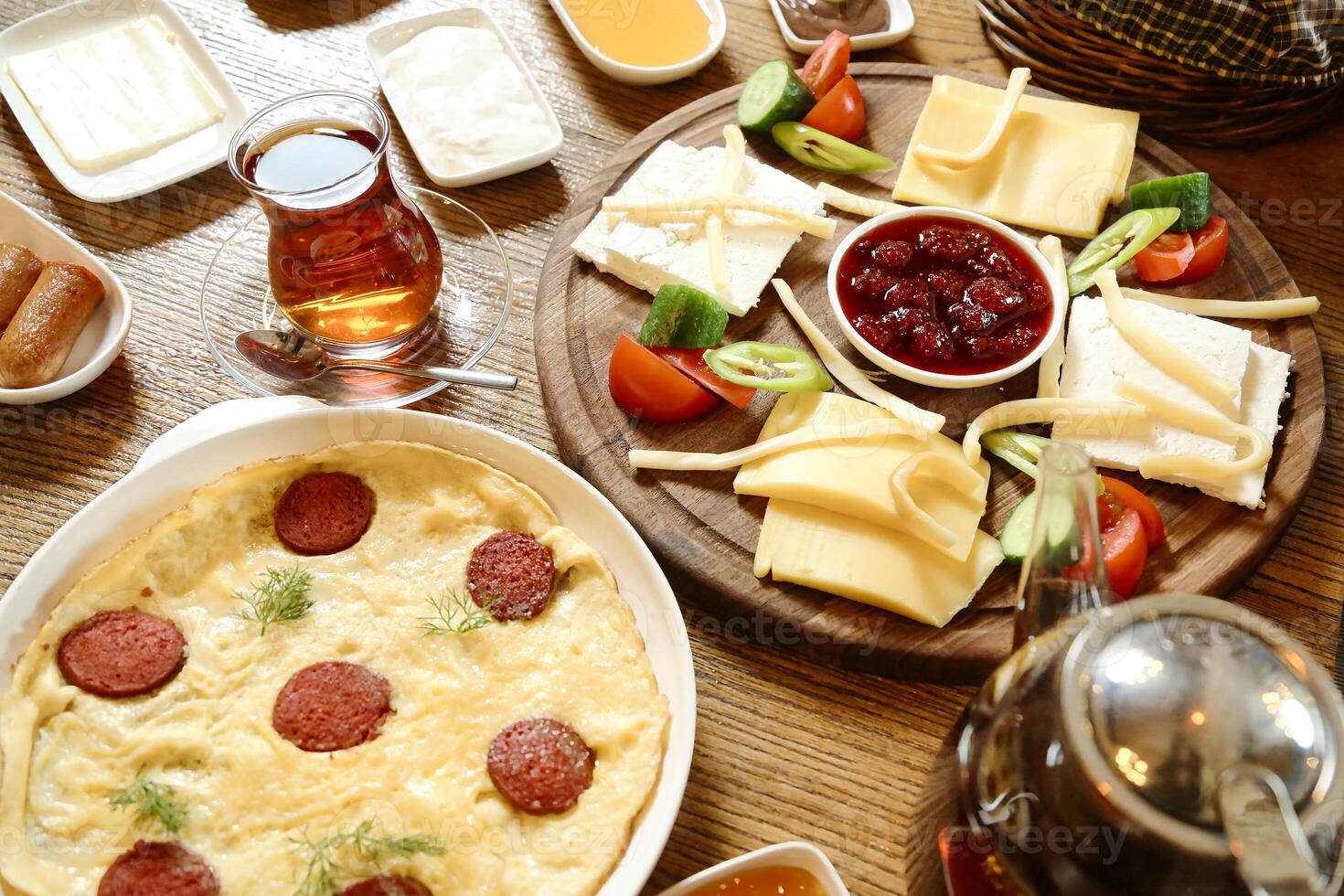 Wooden Table With Assorted Plates of Food photo