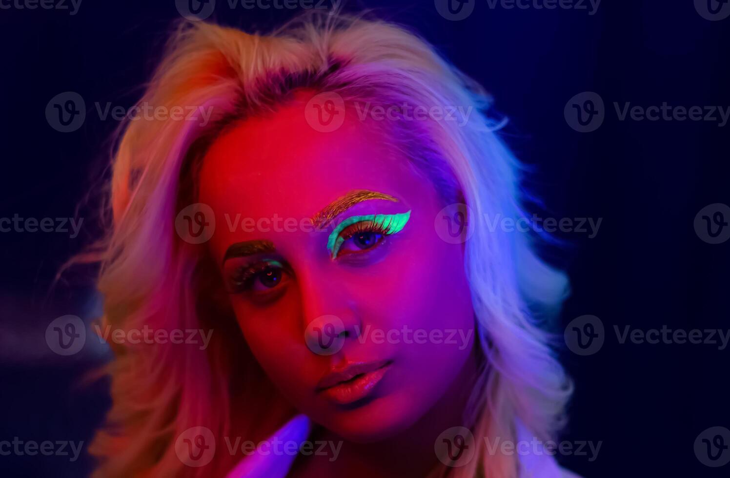 portrait of a woman with painted face, woman with uv makeup in studio, portrait of a woman in carnival mask, the woman is decorated in a ultraviolet powder photo