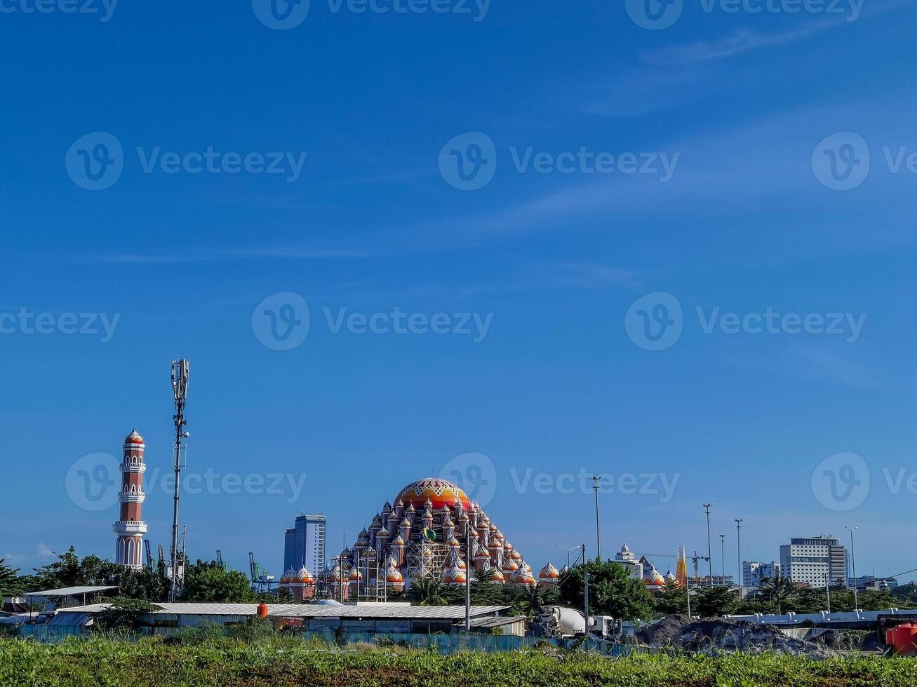 the colorful mosque in the background of the city photo