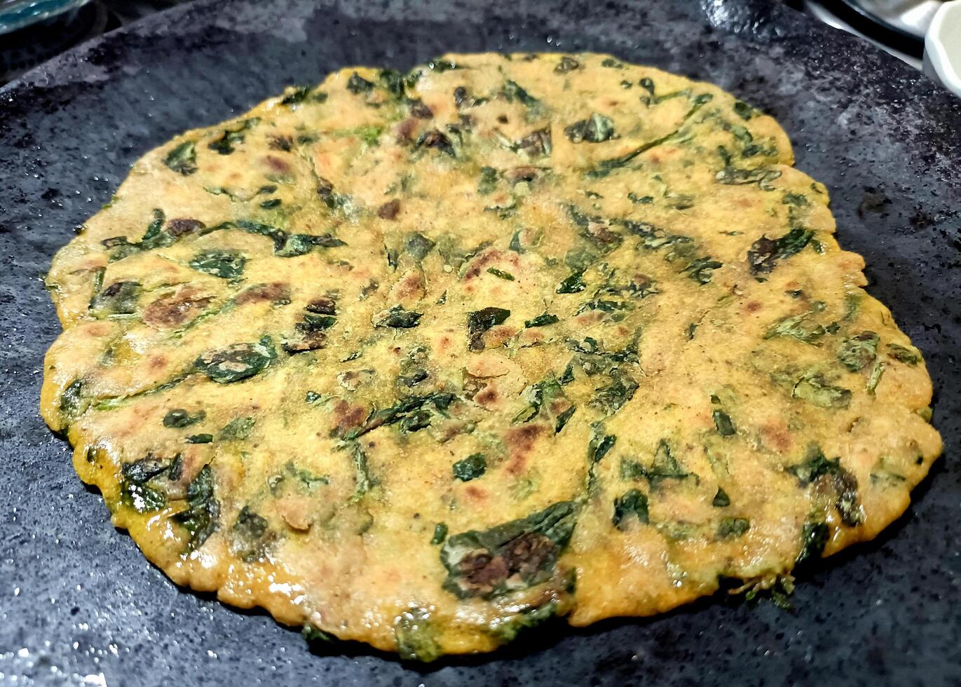 Palak paratha or Indian flat breads made from spinach and served with mango pickle and mint dip, Indian breakfast photo