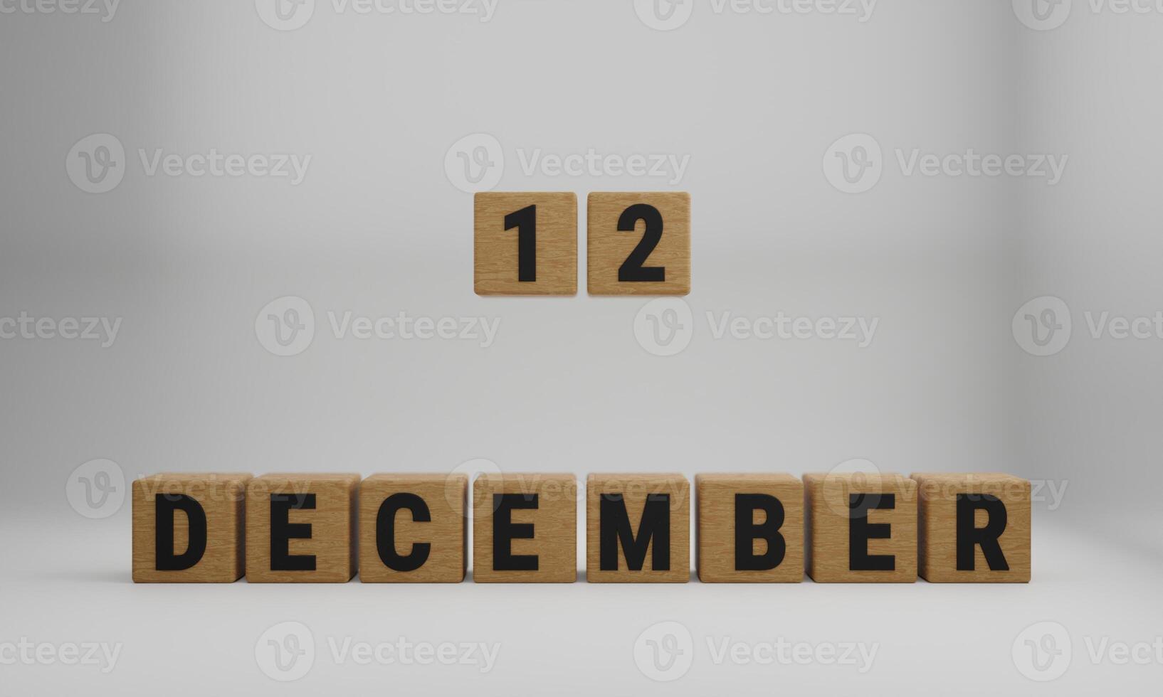 wooden cubes with arranged letters. December and 12 on blurry white background photo