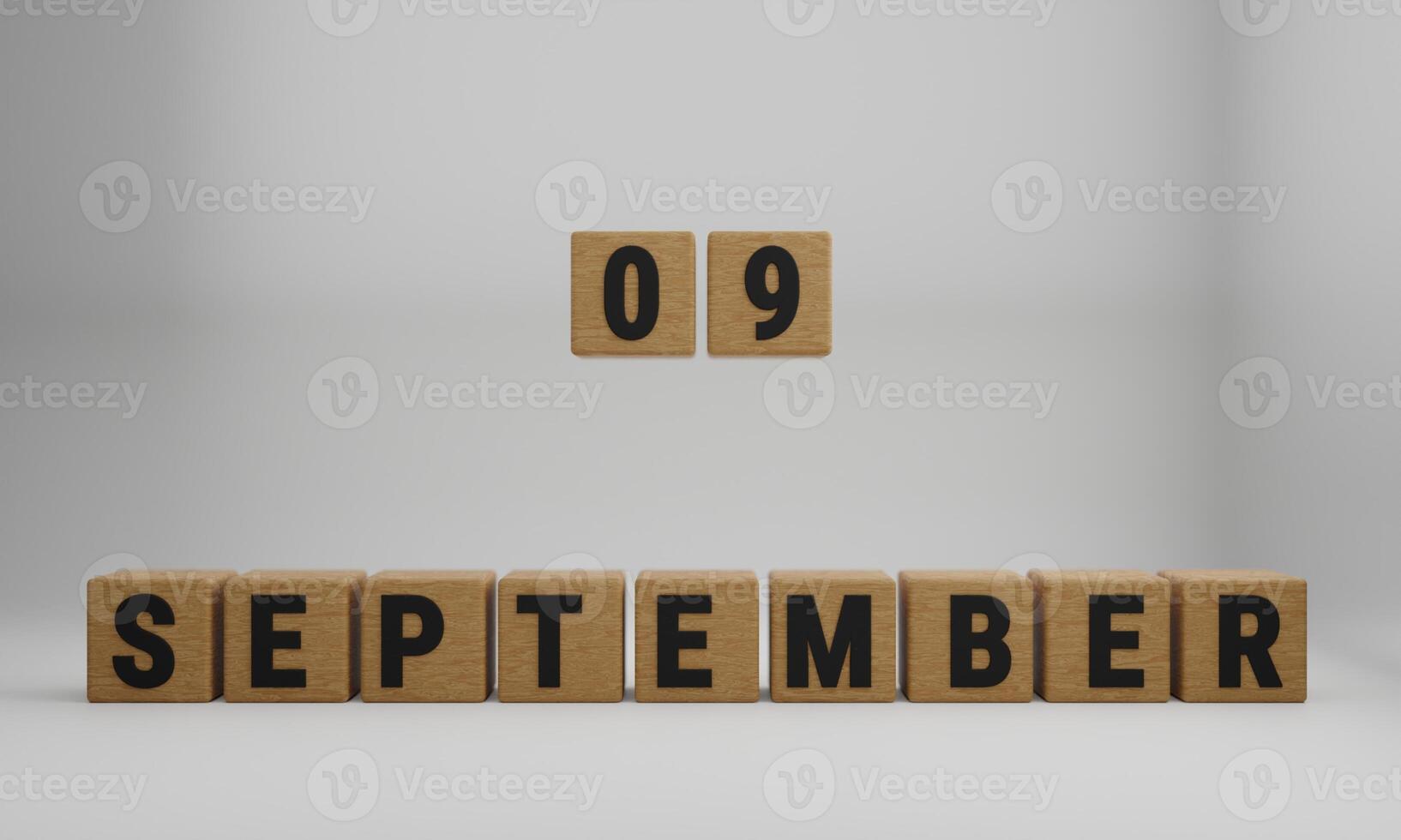 wooden cubes with arranged letters. September and 09 on blurry white background photo