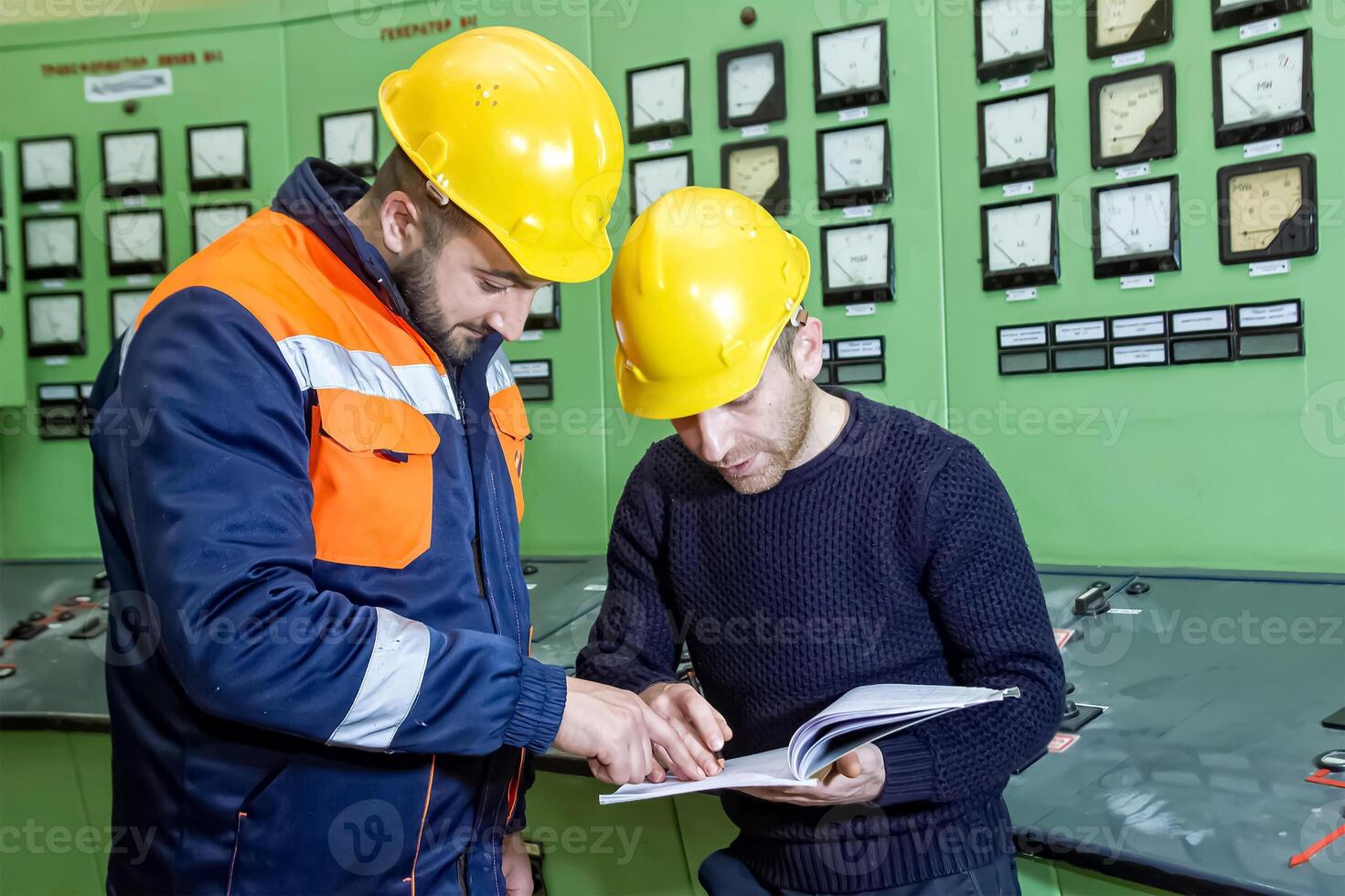 industrial workers at the work in factory photo