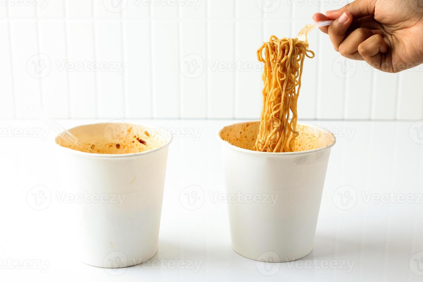 Eat Instant Noodle Cup with Soy and Spicy Sauce photo