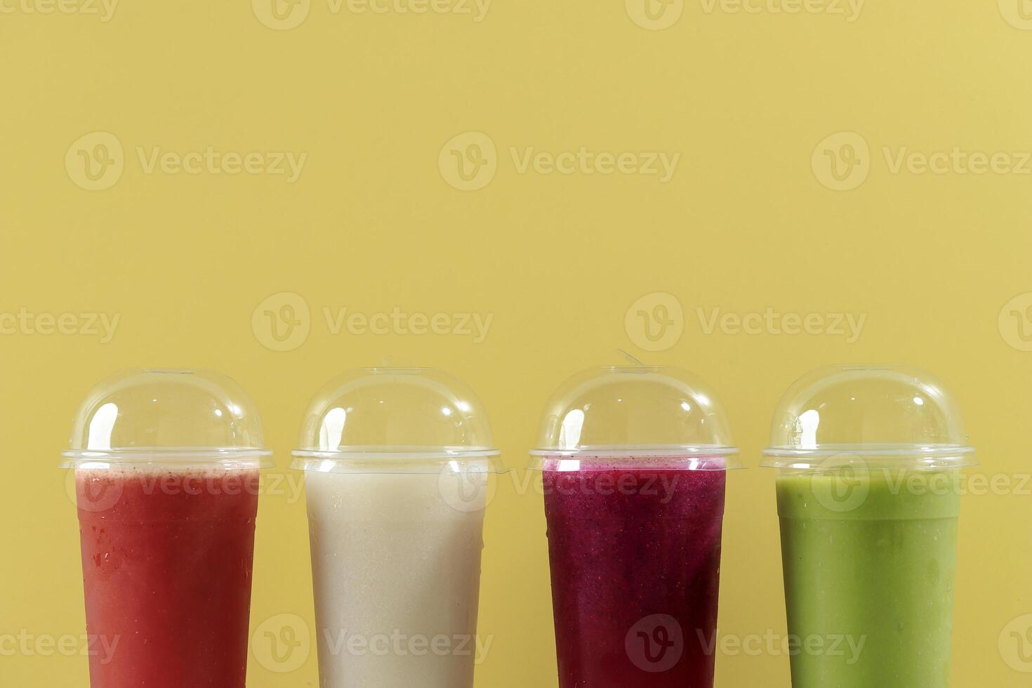 Various Fruit Juisce on Disposable Plastic Cup with Lid photo