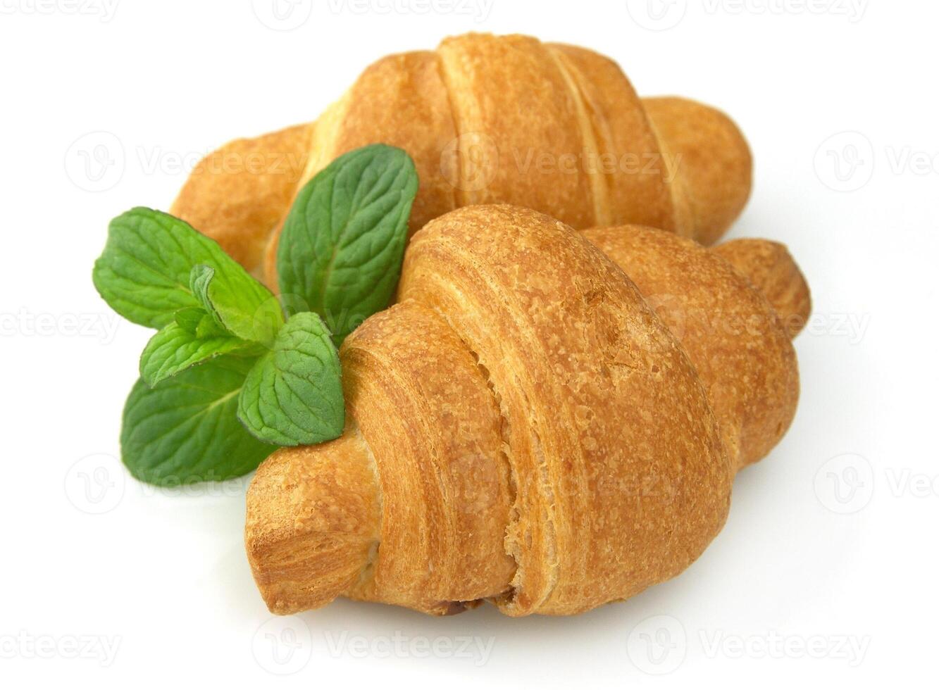 Fresh croissants with mint photo