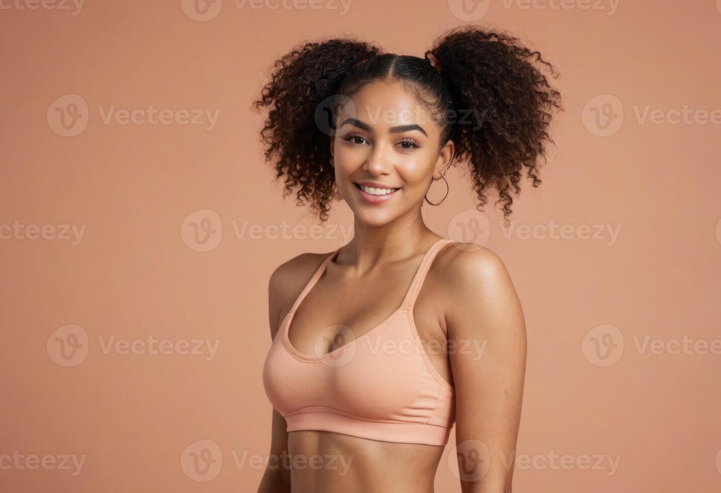 AI Generated A young woman with voluminous curly hair and a sports top, smiling warmly and looking to the side. She represents health and vitality. photo