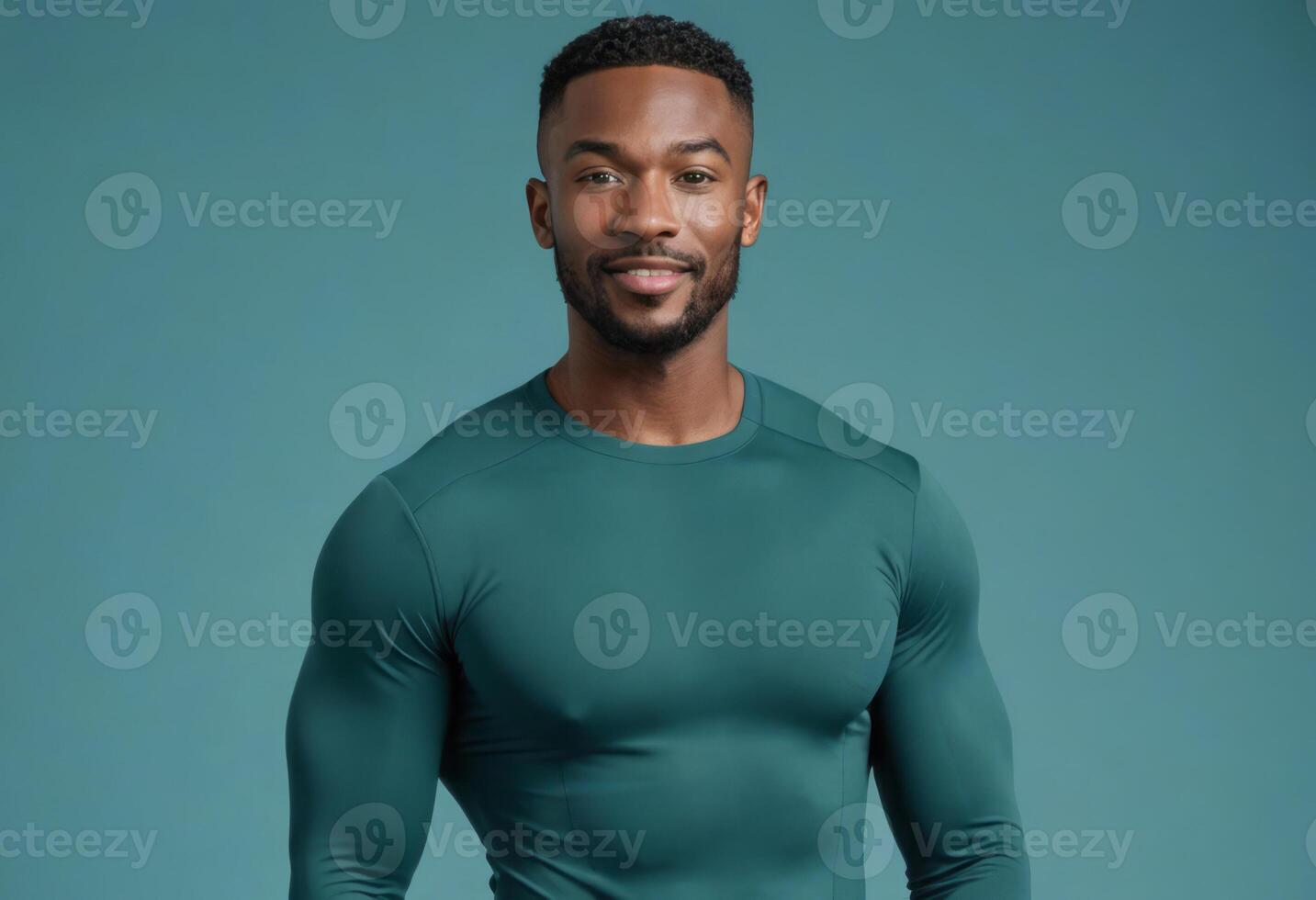 AI Generated A fit male athlete in a green sports shirt stands against a teal background. His posture and attire suggest an active lifestyle. photo