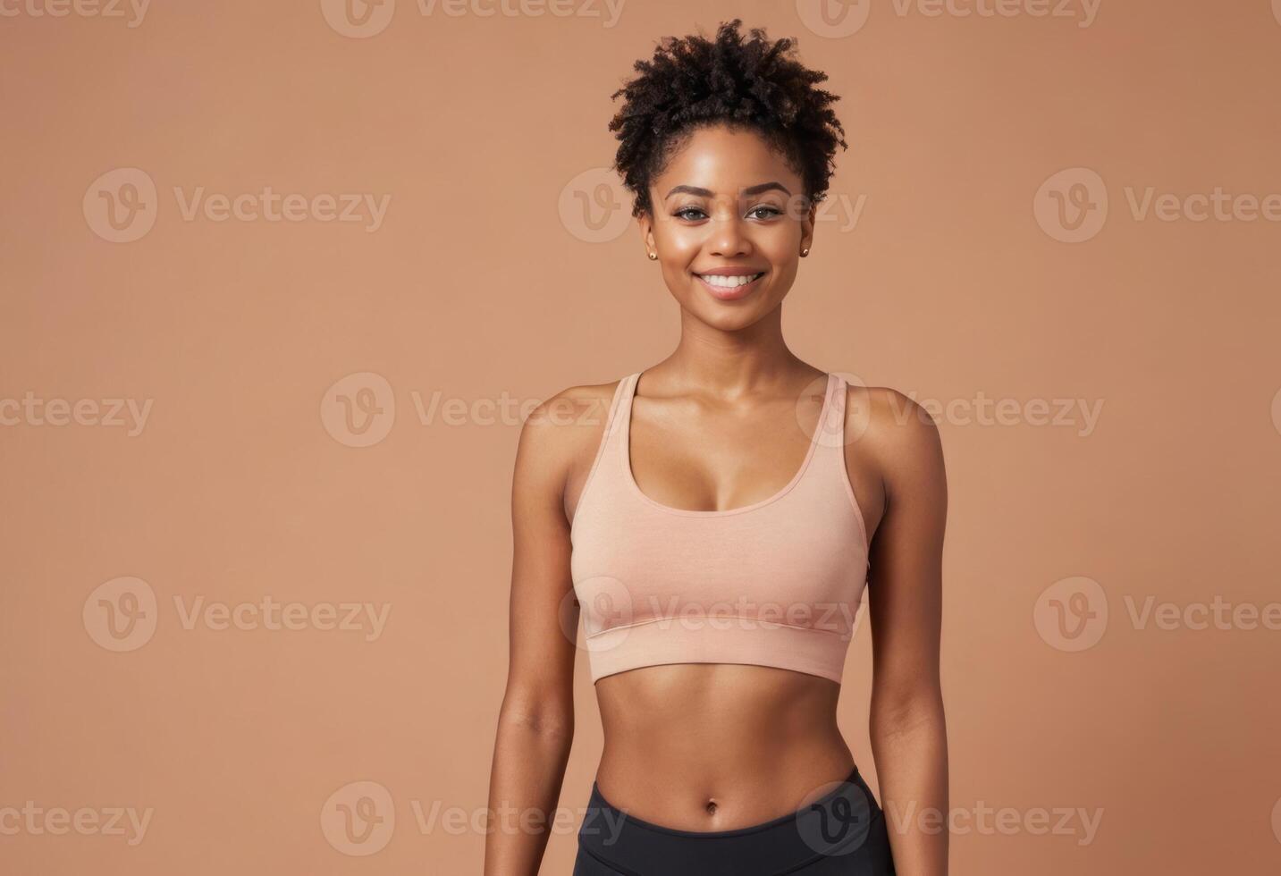 AI Generated A fit young woman in sports attire, peach background. Her confident stance and healthy look portray strength and fitness dedication. photo