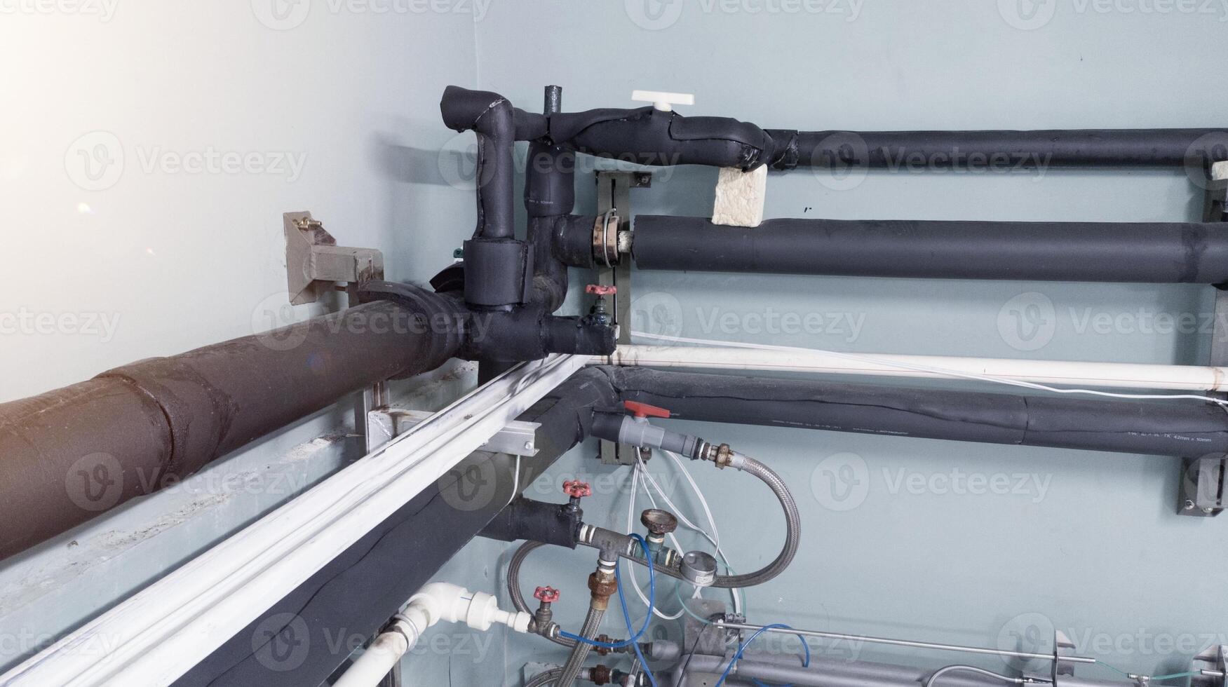 Cold water pipes in cooling machine installations in the hatchery industry. photo