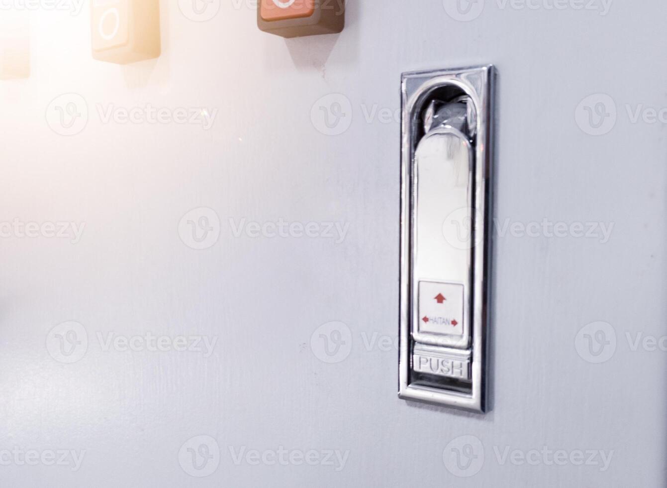 Close up the Modern panel door locks by pressing the push mark on the panel door will open. photo