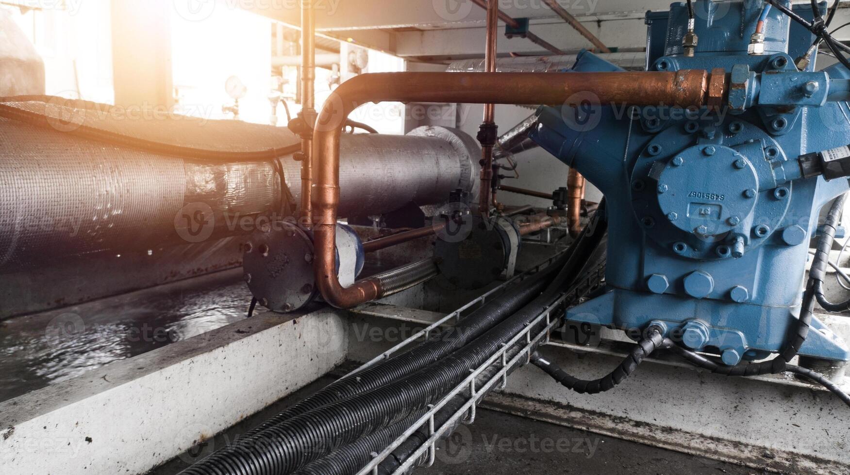 Instalation of compressor chiller unit and refrigerant system ,with refrigerant pipe and cable power. Industrial chiller water cold instalation. photo