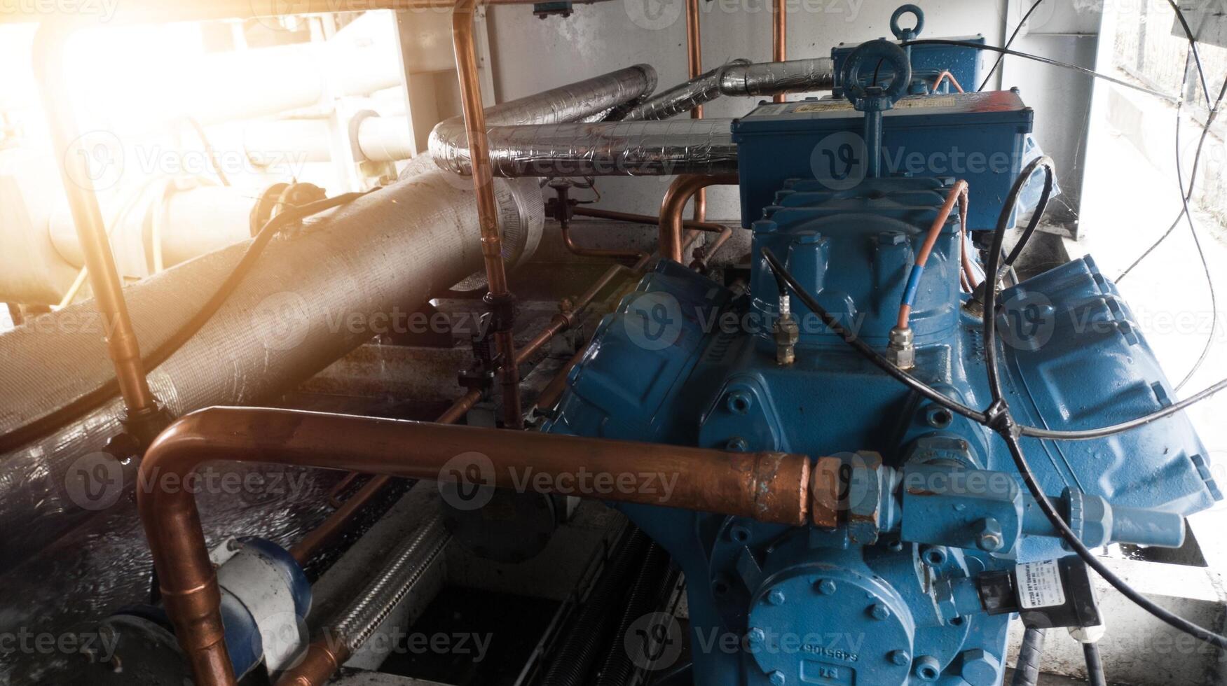 Instalation of compressor chiller unit and refrigerant system ,with refrigerant pipe and cable power. Industrial chiller water cold instalation. photo