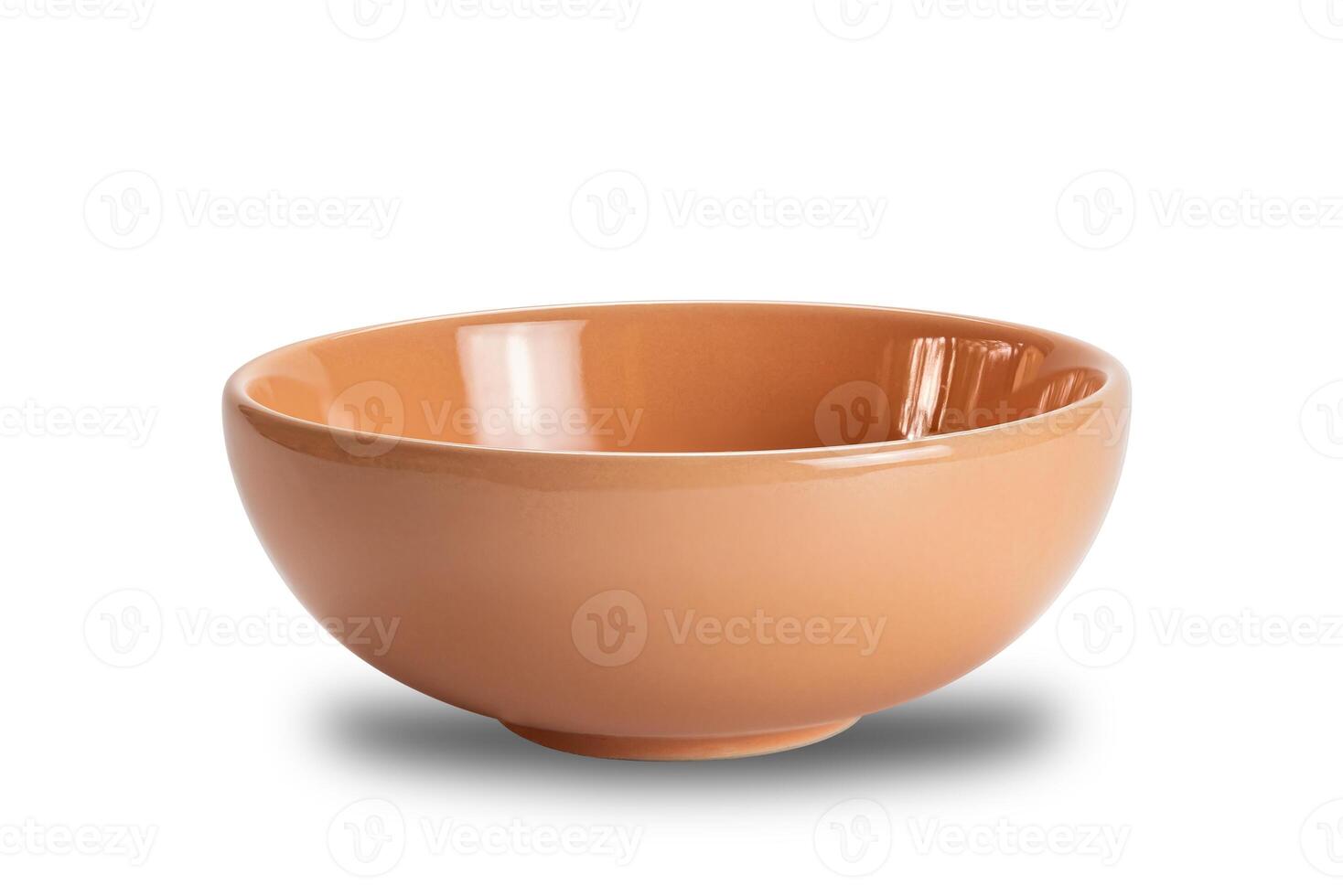 Closeup view of new empty brown ceramic bowl isolated on white background with clipping path. photo