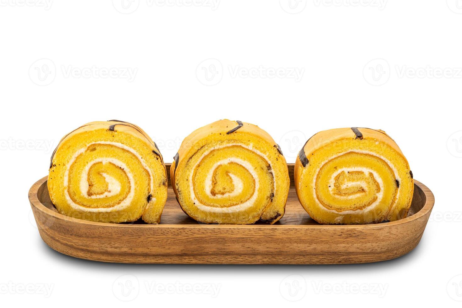 Row of sliced cake roll in a wooden tray on white background with clipping path. photo