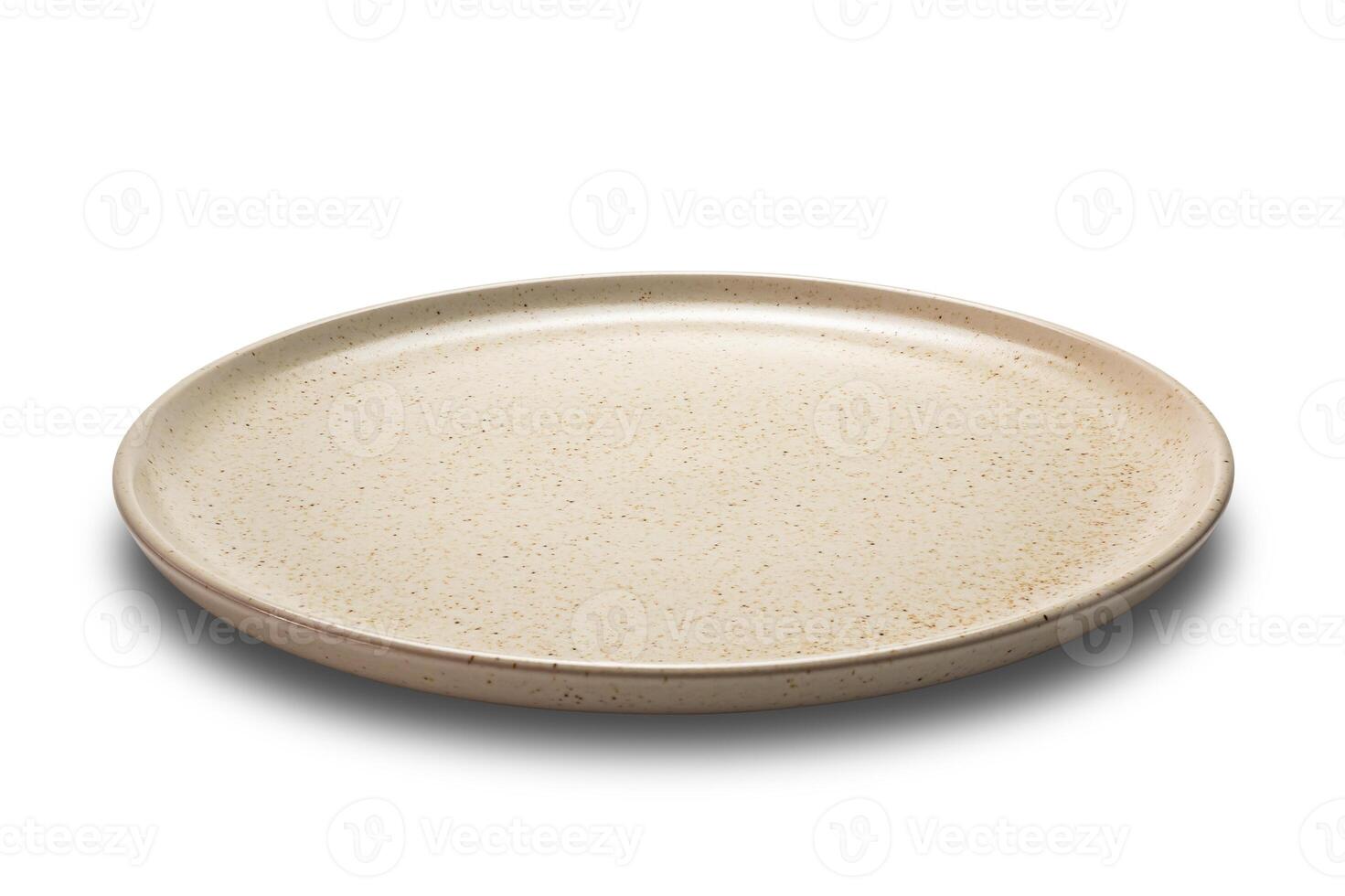 Side view closeup of brown ceramic plate isolated on white background with clipping path. photo