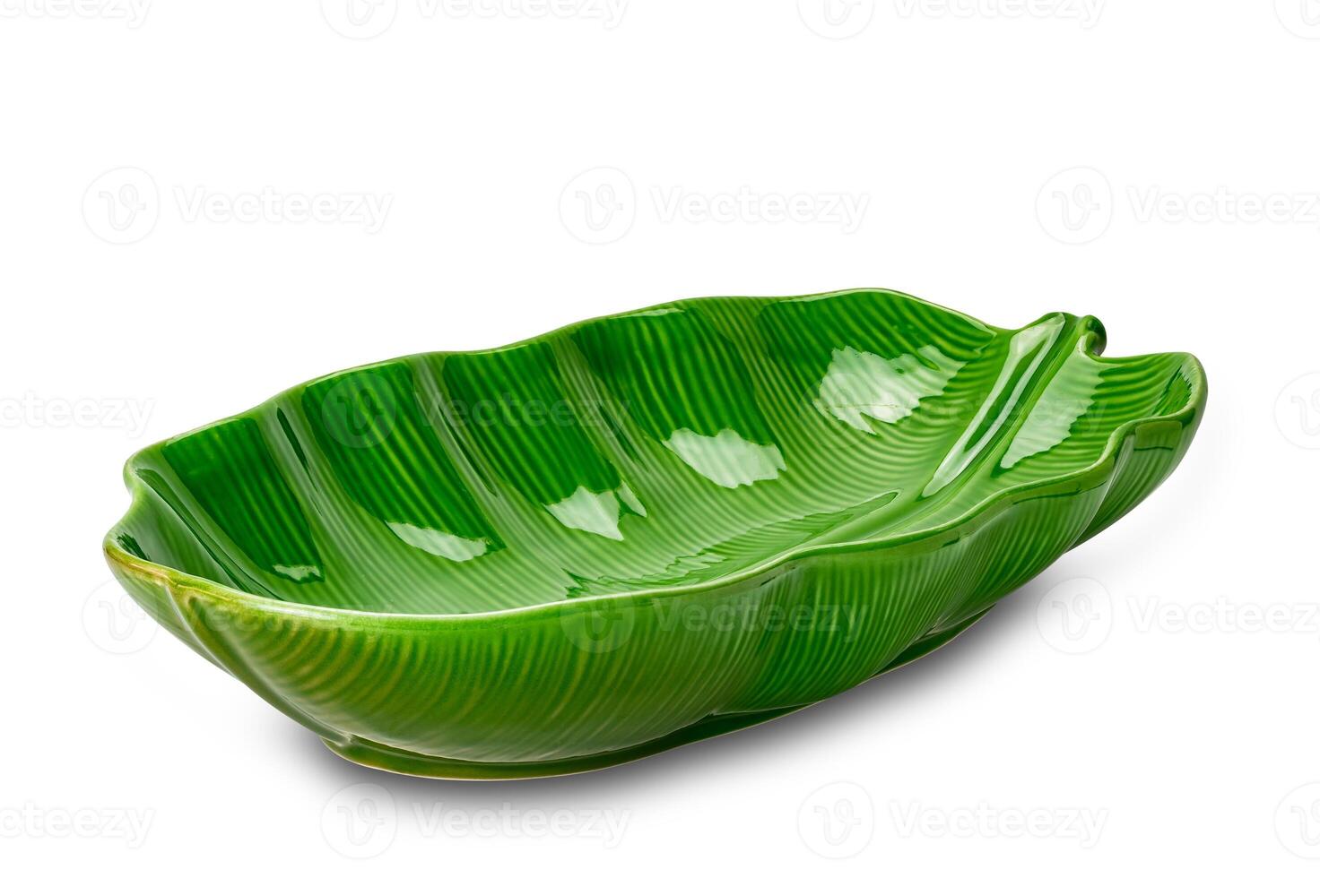 Empty beautiful green leaf shape ceramic bowl isolated on white background with clipping path. High angle view of beautiful design as green leaf ceramic bowl. photo