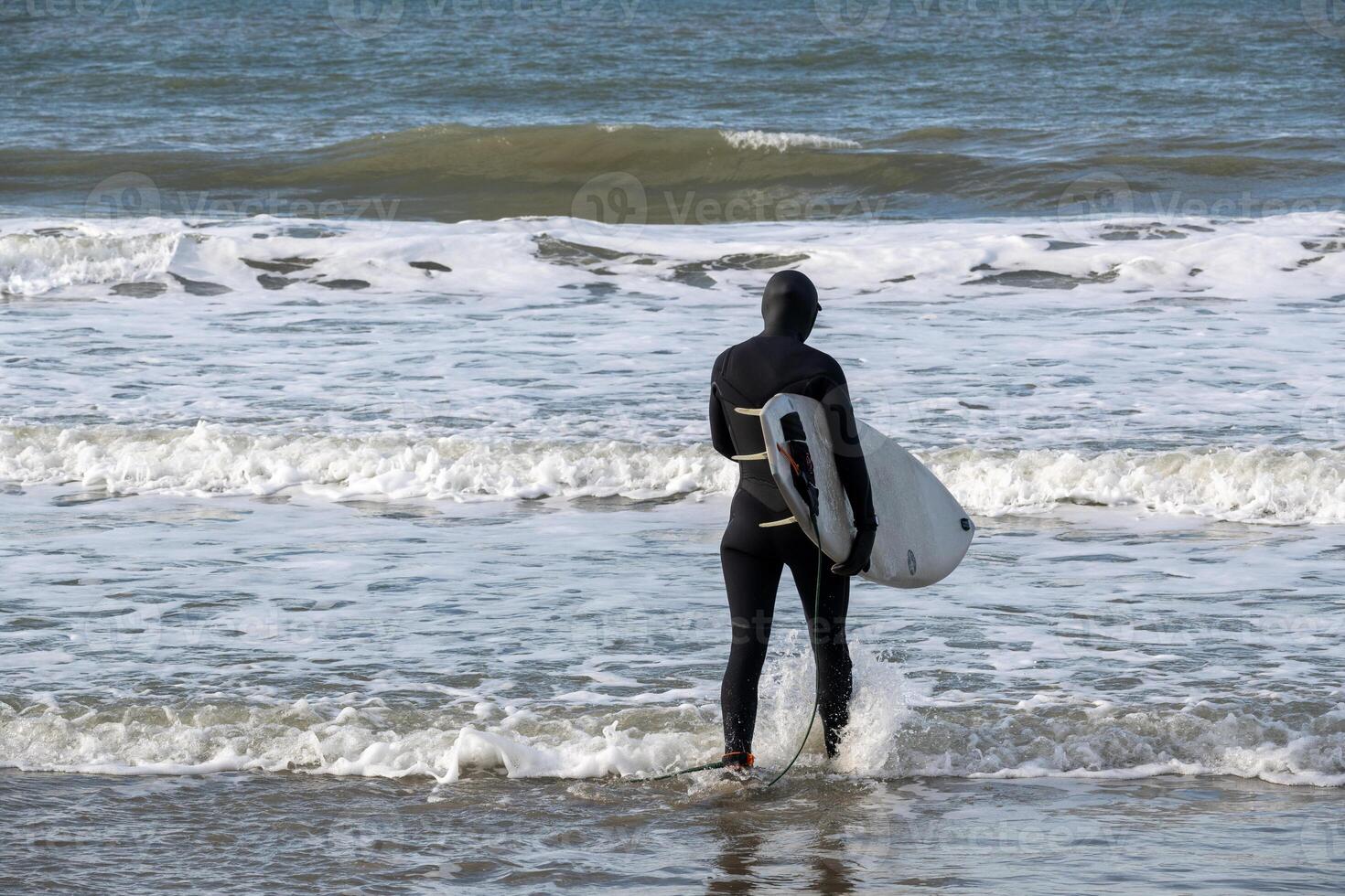 unknown athlete on his way into the water photo