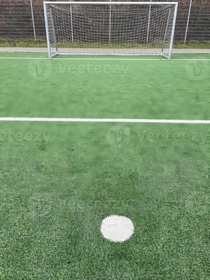 penalty spot in front of a soccer goal photo