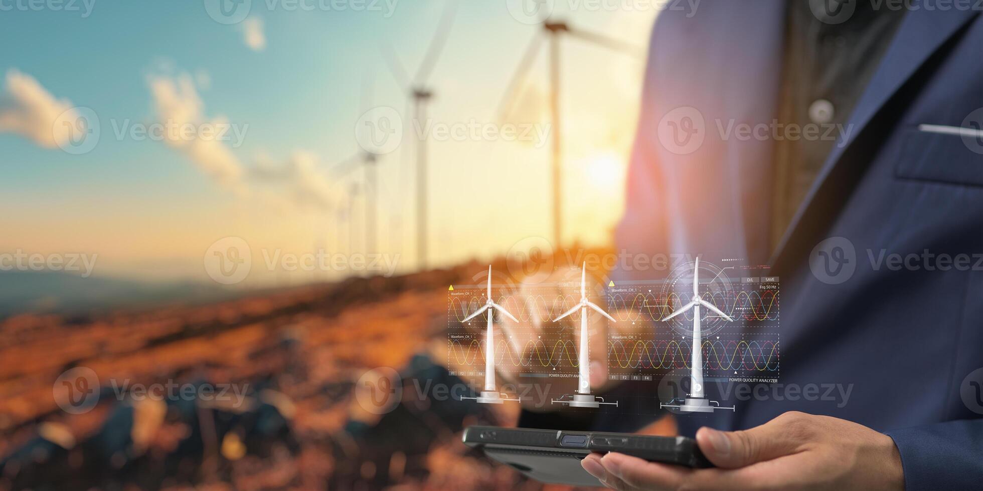 hologram screen Humans controlling the system Wind turbines produce electricity. Eco queue, clean energy from nature. photo