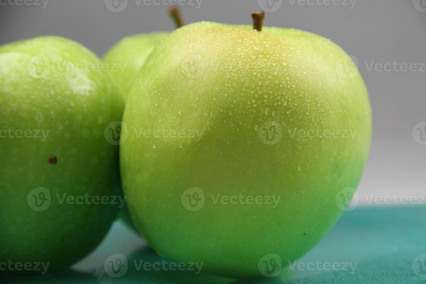 a stack of three green apples photo