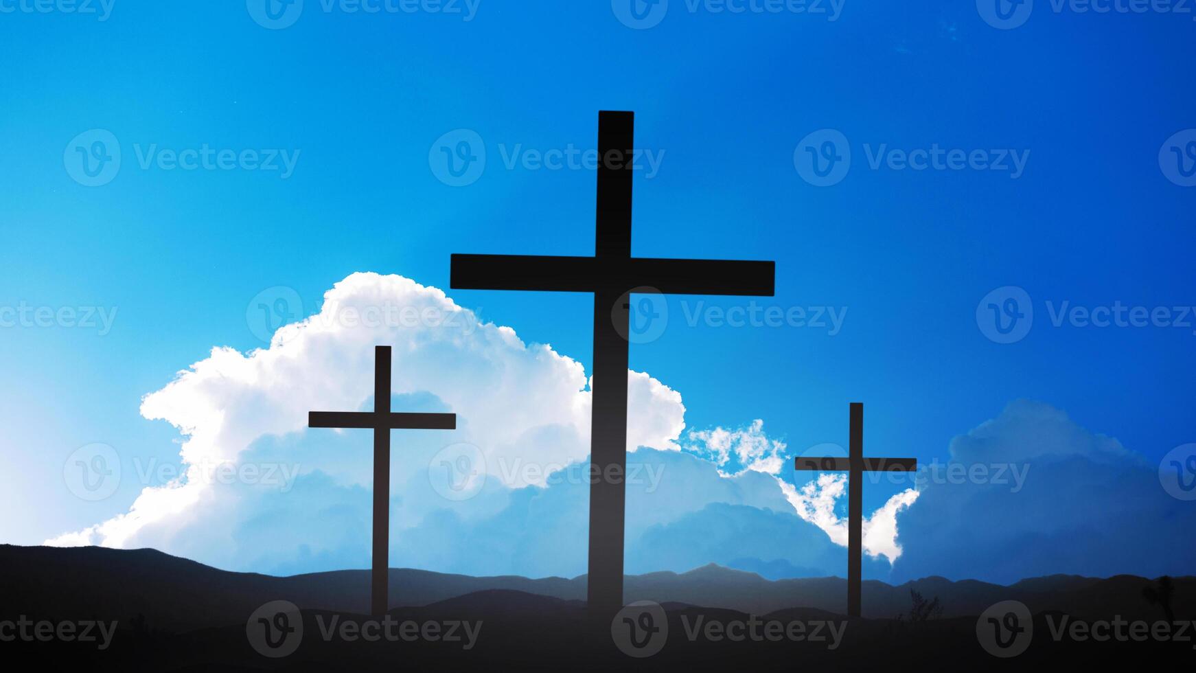 Three silhouette crosses stand in a field with a blue sky with amazing clouds and rays of the sun. Lord God, creative. Deity, concept. Crucifixion of Jesus Christ at dawn - three crosses. Religion photo