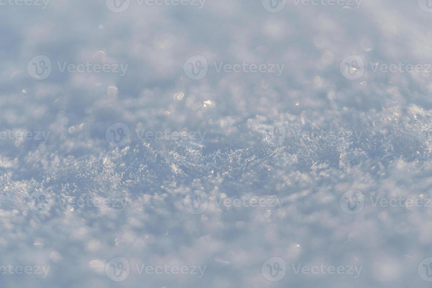 Snow texture macro with snowflakes. Winter background photo