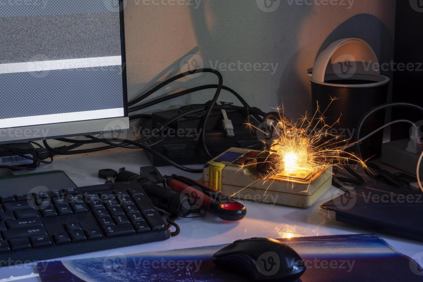 electric plug sparks Caused by short circuit The concept of danger, the use of non-standard equipment worn-out equipment photo