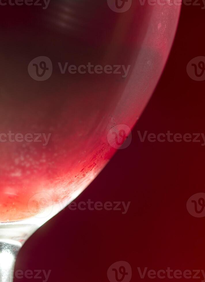 Wineglass with cold red wine photo