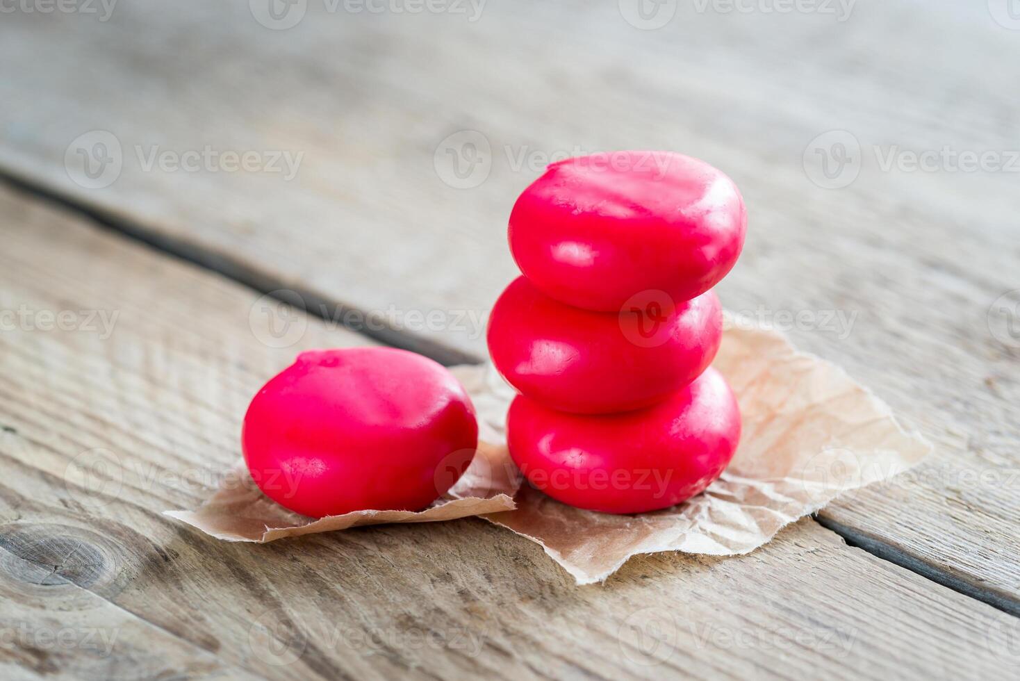 Stack of mini cheese on the wooden table photo