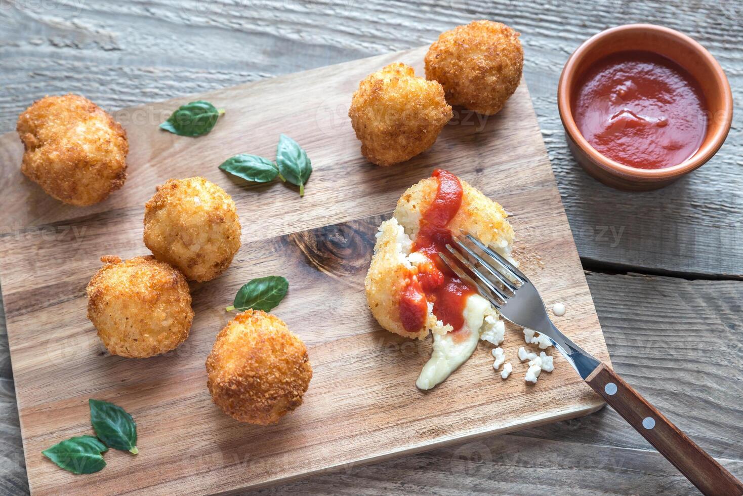 Arancini - rice balls with mozzarella photo