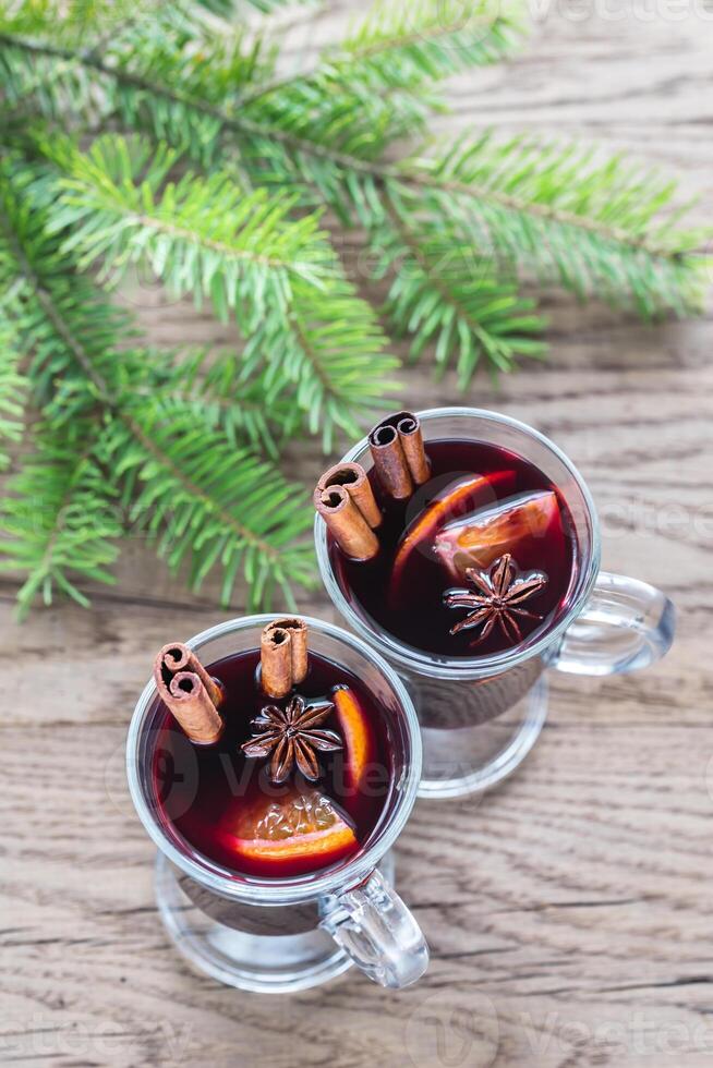 Two glasses of mulled wine with fir branch photo