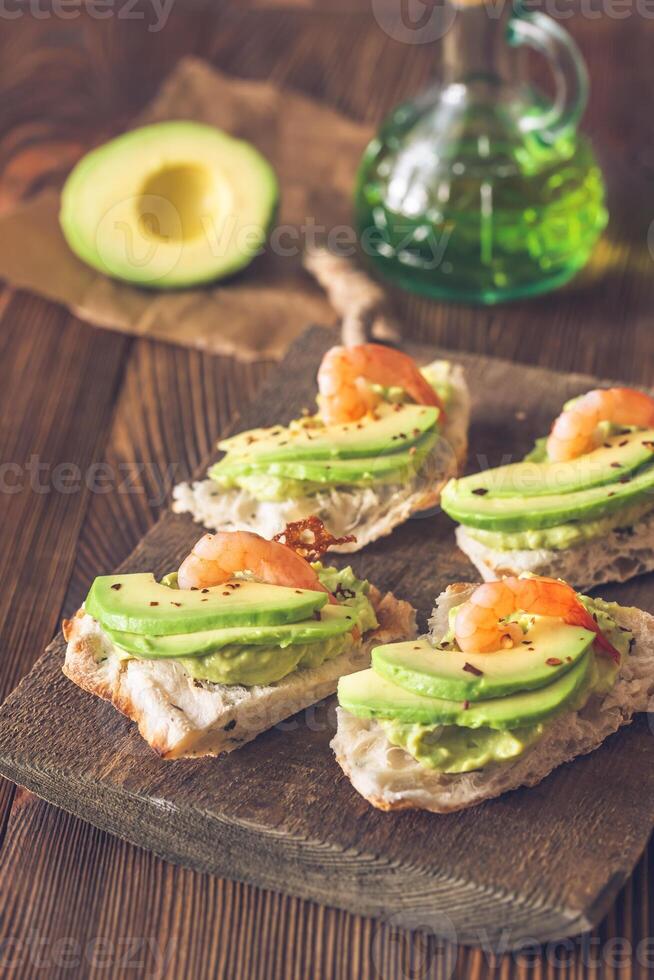 Sandwiches with avocado and shrimps photo