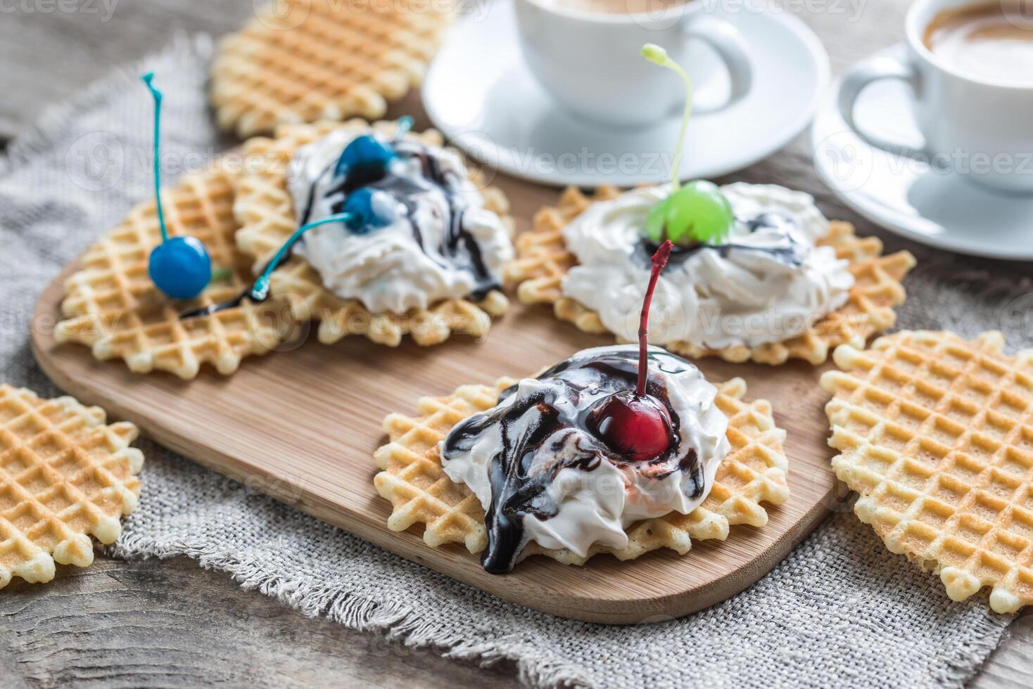 Belgian waffles with whipped cream and chocolate topping photo