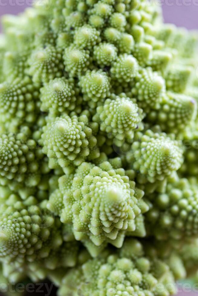 Fresh romanesco broccoli on the wooden board photo