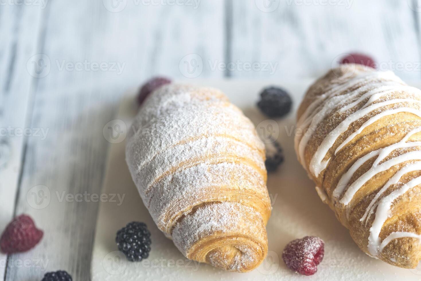 Croissants with fresh berries photo