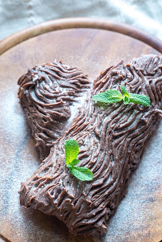 Yule log on the wooden board photo