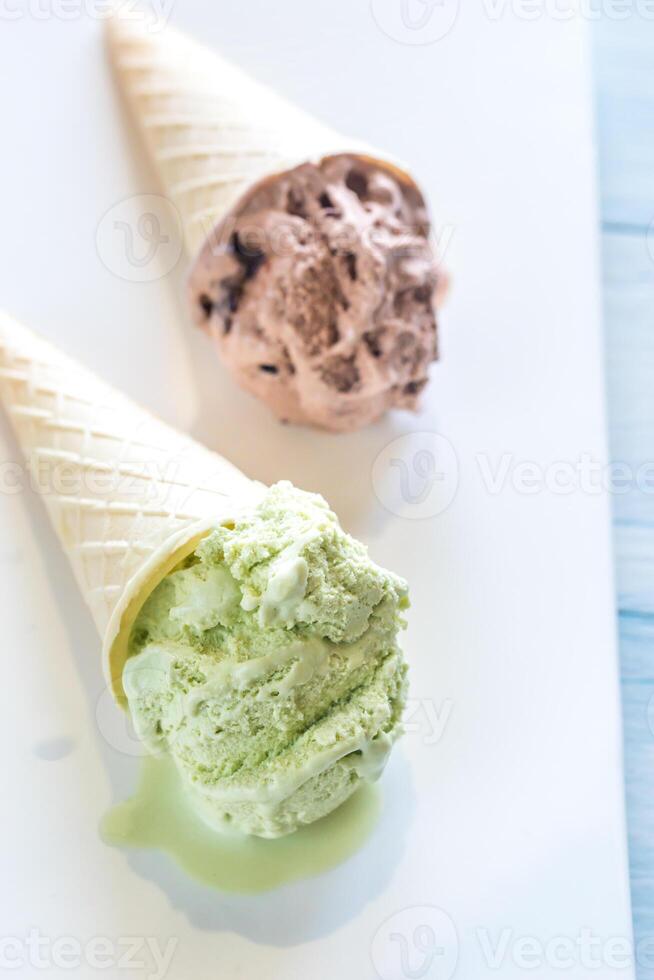 Two cones of nut-flavored ice cream photo