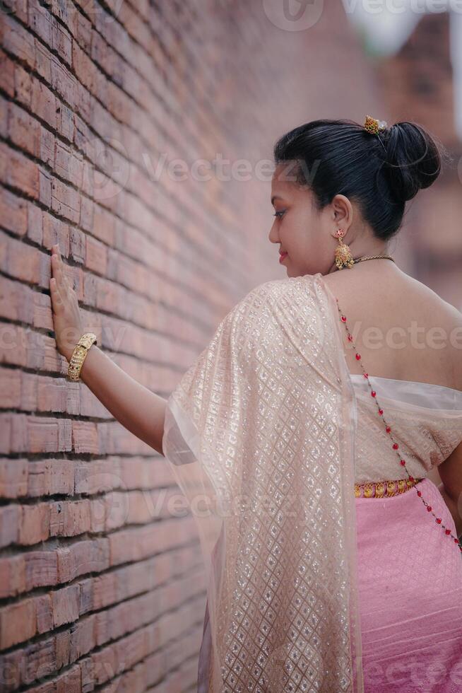 Model near 19th century wall Tha Phae gate Old city in Chiang Mai Thailand photo