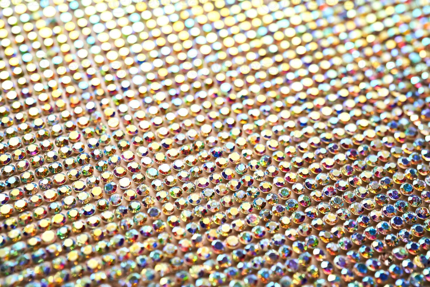 Abstract background made of rhinestones shimmering in the light. photo