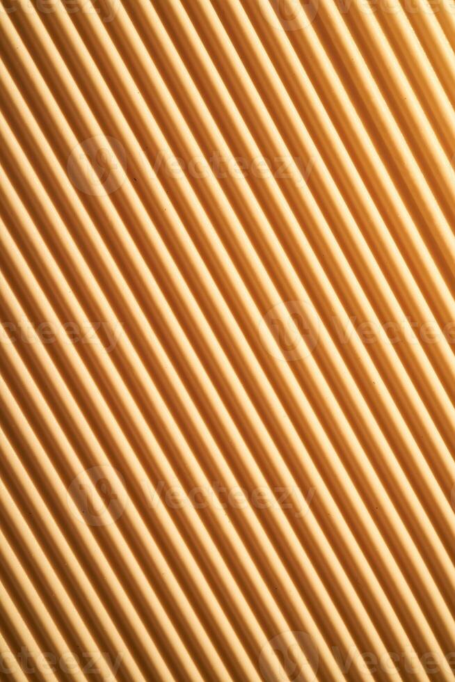 Ribbed beige texture with diagonal grooves. photo