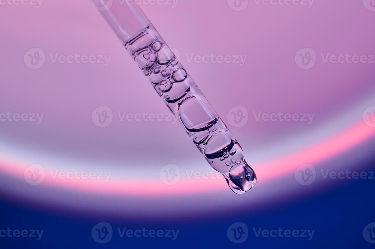 Pipette with serum in a space atmosphere. photo