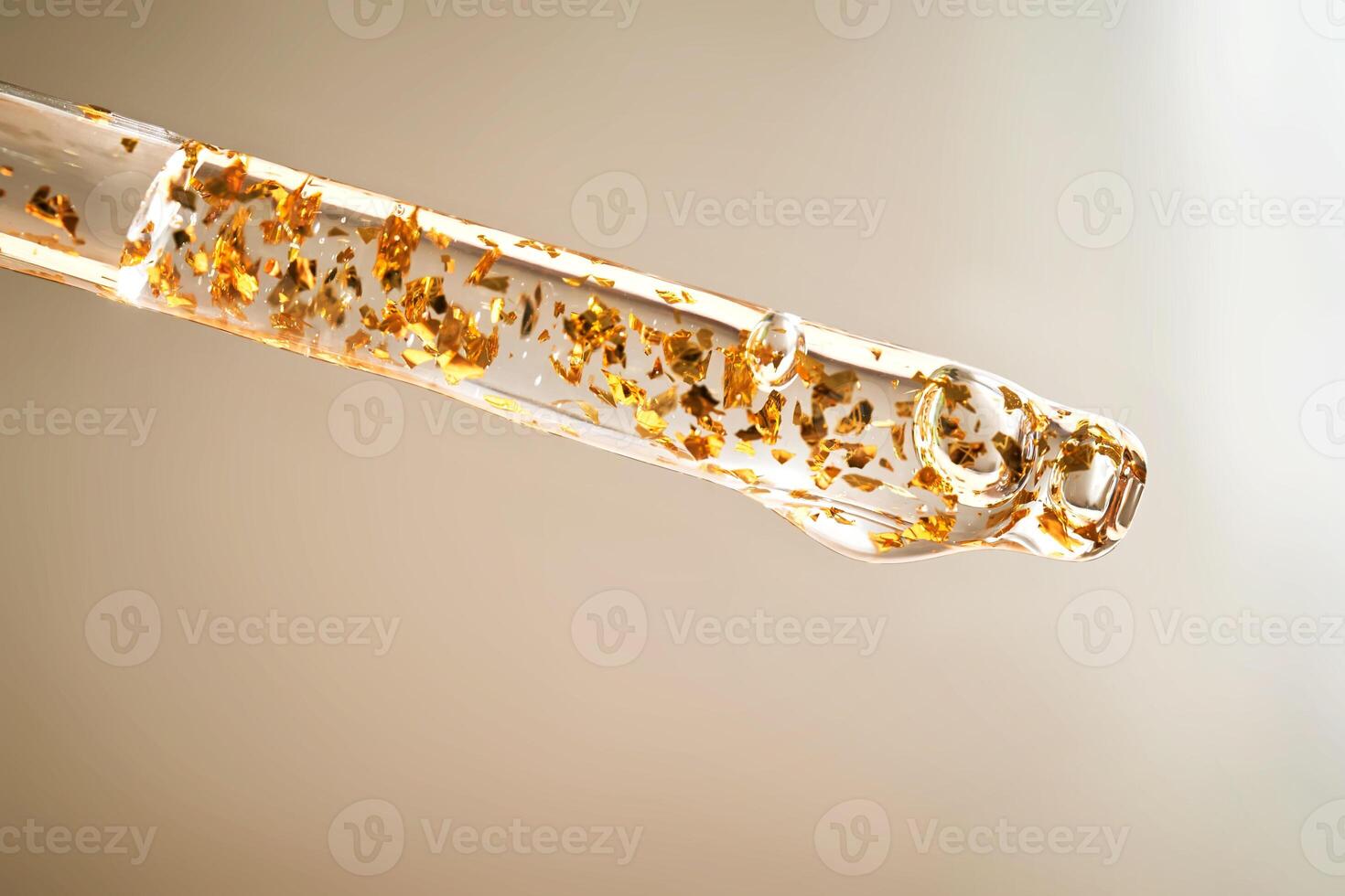 Serum pipette with 24K Gold particles. photo