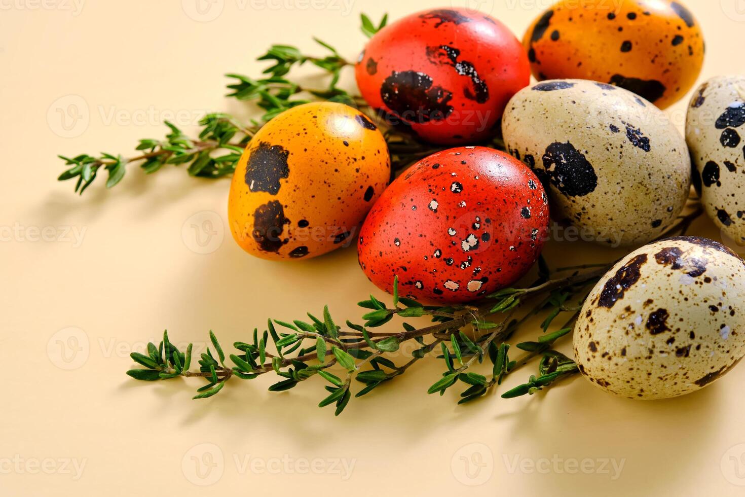 Easter composition of quail eggs and grass on a beige background. photo