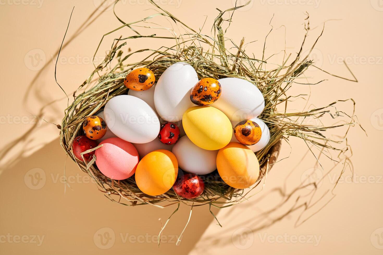 Easter colored eggs in a wicker basket. Easter composition. photo