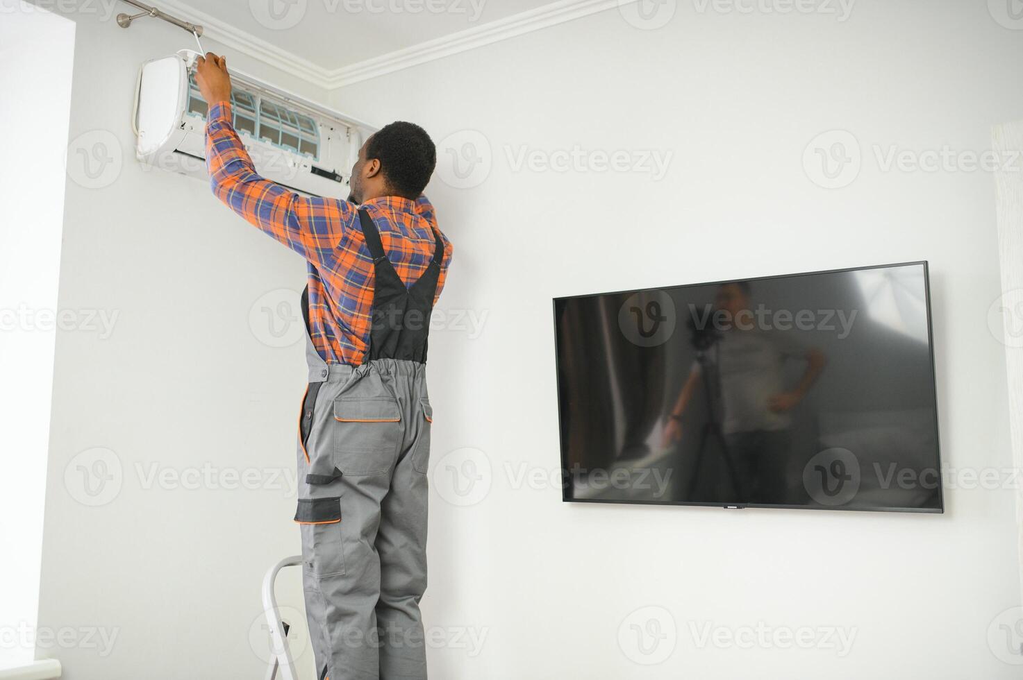 AC Electrician Technician Repairing Air Conditioner Appliance photo